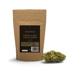 Naturecan Fresh Kase CBD Flower – kraft paper stand-up pouch with dark label, Fresh Kase CBD Flower less than 0.3% THC 10g, with a large CBD flower bud displayed beside it on white background