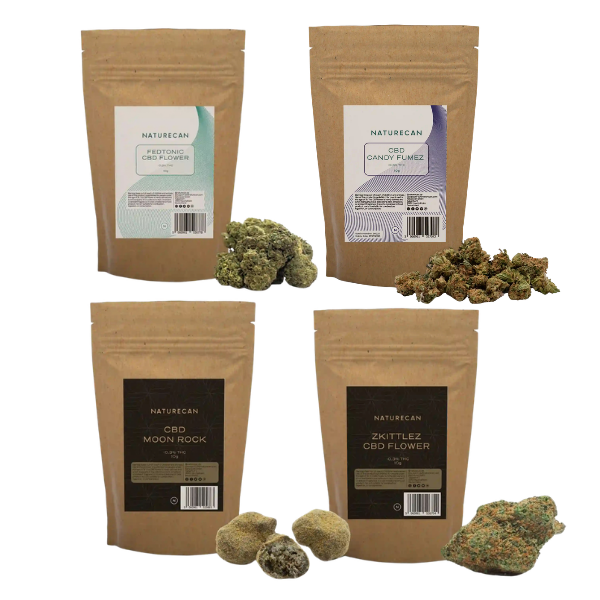 Four Naturecan CBD flower and CBD marijuana stand-up pouches arranged in a 2x2 grid, with loose green and orange-brown buds placed in front of each package on a plain white background.