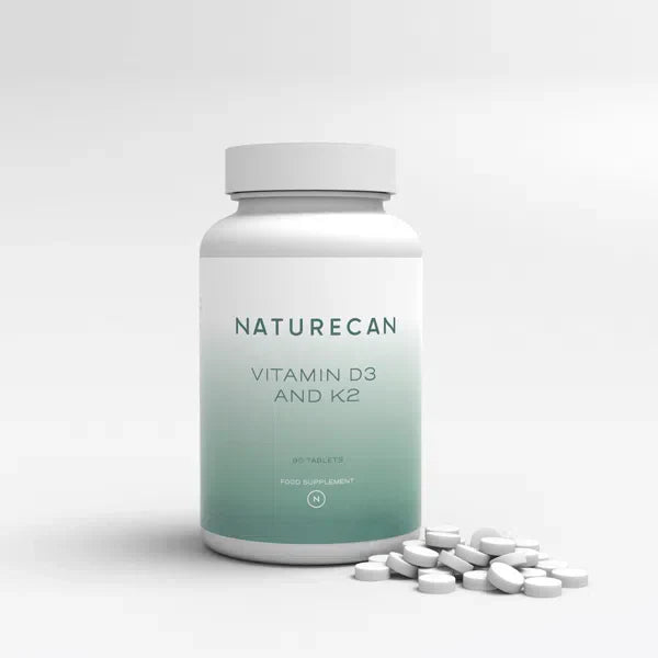 Naturecan Vitamin D3 and K2 – white and teal gradient bottle, 90 tablets, food supplement, Naturecan N logo, with small white tablets scattered beside it