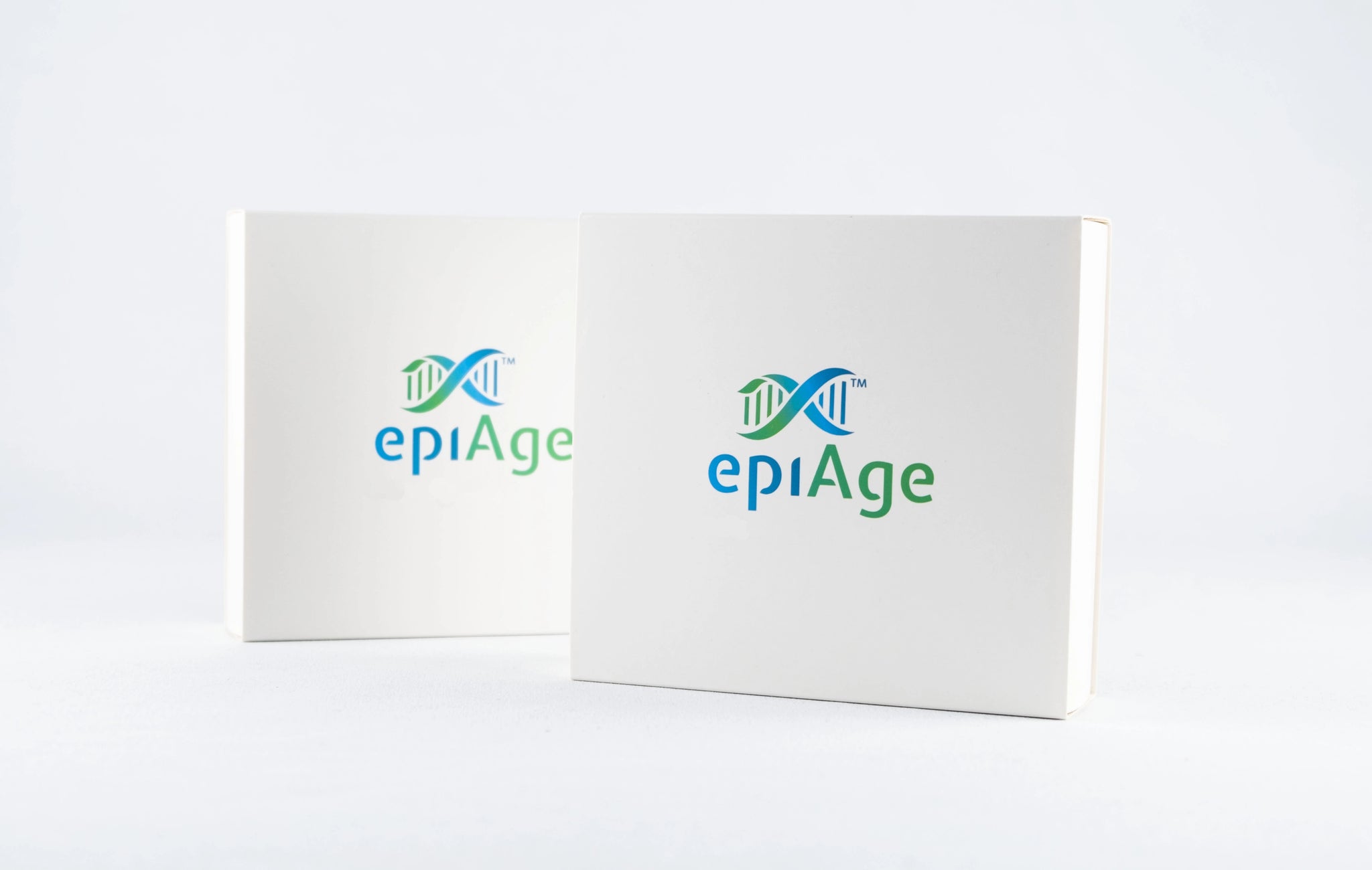 epiAge Biological Age Testing Kit – two white square epiAge boxes angled together showing front and side views with DNA logo
